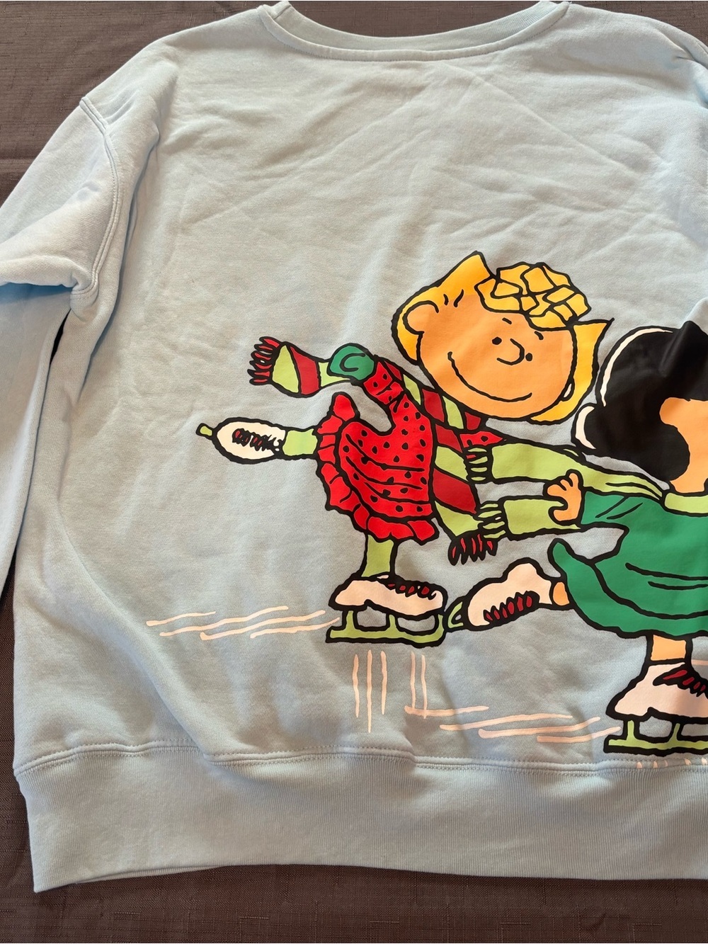 Peanuts Light Blue Crewneck Sweatshirt with Ice Skating Graphic - Picture 6 of 10